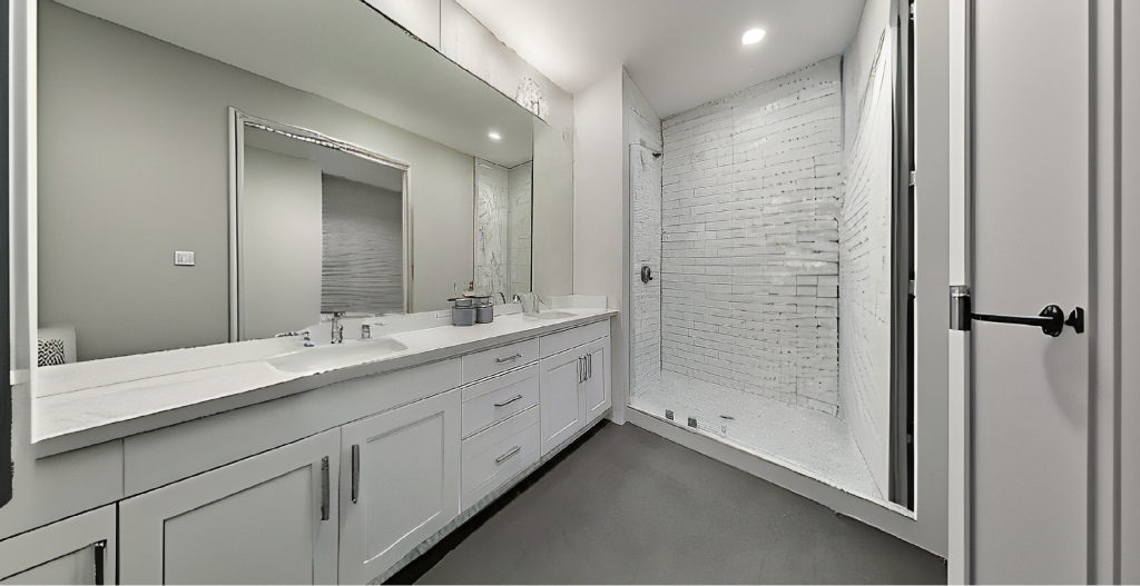 newly remodeled bathroom with grey minimialistic interior